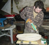 Stephen laying adhesive for the placing of the deck. Photo: Marianne Green